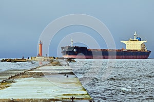 Freight ship on windy day in autumn going from port to the Baltic sea