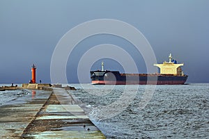 Freight ship on windy day in autumn going from port to the Baltic sea