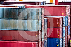 Freight shipping. Dozens of cargo containers stacked in a shipping yard