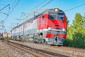 Freight three section diesel locomotive approaches to the station