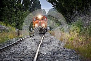 Freight Train Approaching Railroad Crossing