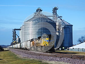 Freight train being loaded with grain for transport