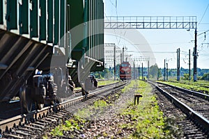 Freight train catches the wagons at the railway station