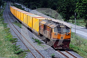 Freight train by diesel locomotive on the railway