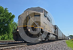 Freight train locomotive pulling car transports