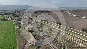 Freight train with open wagons. Cargo trains arrives at the industrial depot