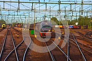Freight train passing railway station