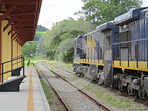 Freight train passing through small station