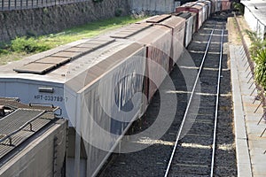 Freight train. Rails in urban area of the city, Brazil, South America, side view