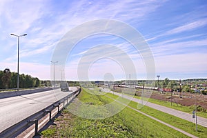 Freight train on railway station and car moves