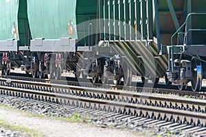 Freight train standing on rails. couple of railway wagons stays on the rails