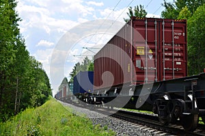 Freight train, transportation of railway cars by cargo containers shipping.