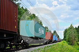 Freight train, transportation of railway cars by cargo containers shipping.