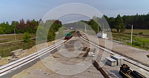 Freight train transports containers view from the drone, transportation of cargo by train, transportation of containers