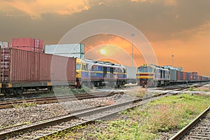 Freight trains on cargo terminal at dusk