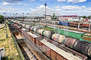 Freight trains at a railway station, view from above in summer d