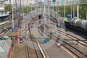 Freight trains at railway station and workers