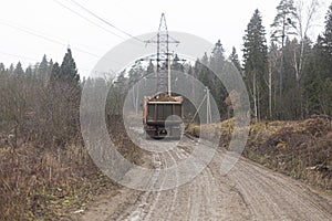 Freight transport in the city. Construction vehicles on the street. Work on a truck