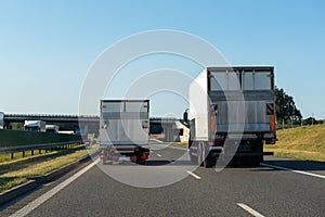 Freight trucks on a highway.