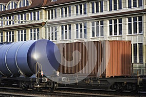 Freight wagons train on railway tracks. Close-up of freight trains