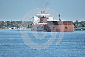 Freighter Heads Down River During Early Fall
