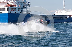 Freighter and RIB boat photo