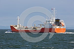 Freighter sailing towards Northsea at Firth of Forth near Edinburgh