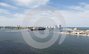 Freighter and Tugboats Leaving Harbor