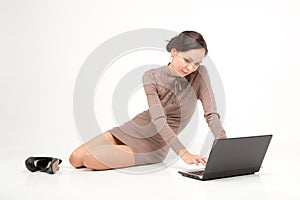 Frelance woman sit on the floor with notebook photo