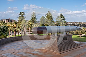 Fremantle, Australia - November 25. 2009: Closeup of gray and black torpedo on display at local war memorial. under blue sky with