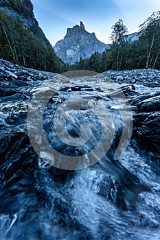 French Alps landscape of Cirque du Fer a Cheval with river flowing in the valley at Sixt Fer a Cheval, France