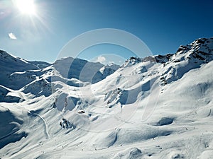 Winter resort drone shot of piste and backcountry area photo