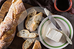 French baguette with butter for breakfast