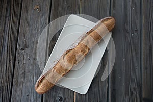 French baguette in wooden background
