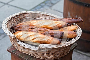 French baguettes in a wicker basket. Outdoor