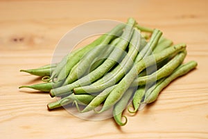 French Beans on a wooden surface photo
