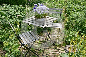 French bistro table and chairs in a garden