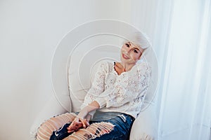 French blonde in a white room white