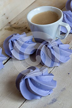 French blue meringue cookies and cup of coffee