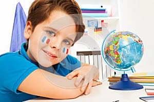 French boy learning geography with the globe