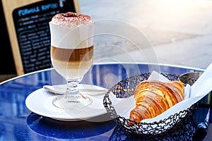 French breakfast. Cappuccino with croissant