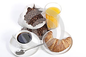 French breakfast from coffee cup with orange juice