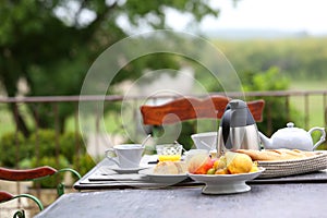 French breakfast placed on table of garden