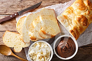 French brioche bread and cream mascarpone cheese, chocolate cream close-up. Horizontal top view