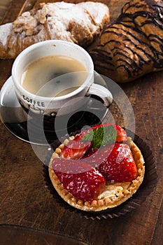 French cakes on wood background