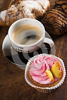 French cakes on wood background