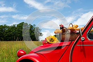 French car with bread and wine