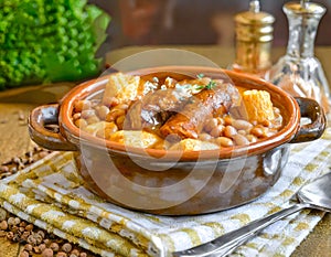 French Cassoulet. Hearty French sausage and bean stew with a crispy breadcrumb topping