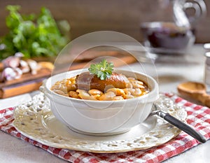 French Cassoulet. Hearty French sausage and bean stew with a crispy breadcrumb topping