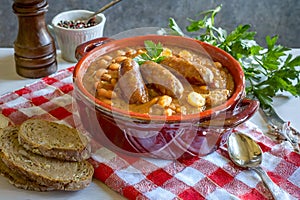 French Cassoulet. Hearty French sausage and bean stew with a crispy breadcrumb topping